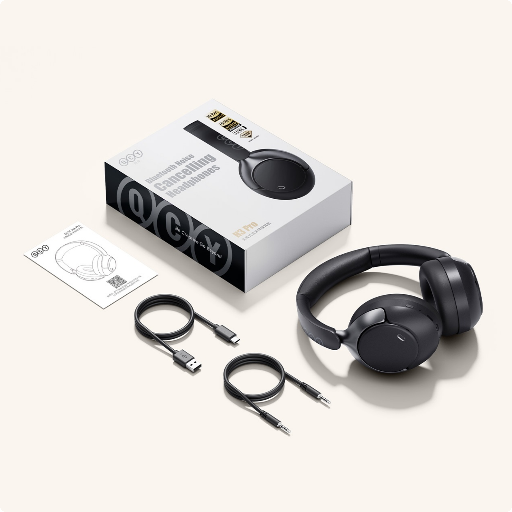 Słuchawki Bluetooth QCY H3 Pro z redukcją szumów, kablami i opakowaniem.
