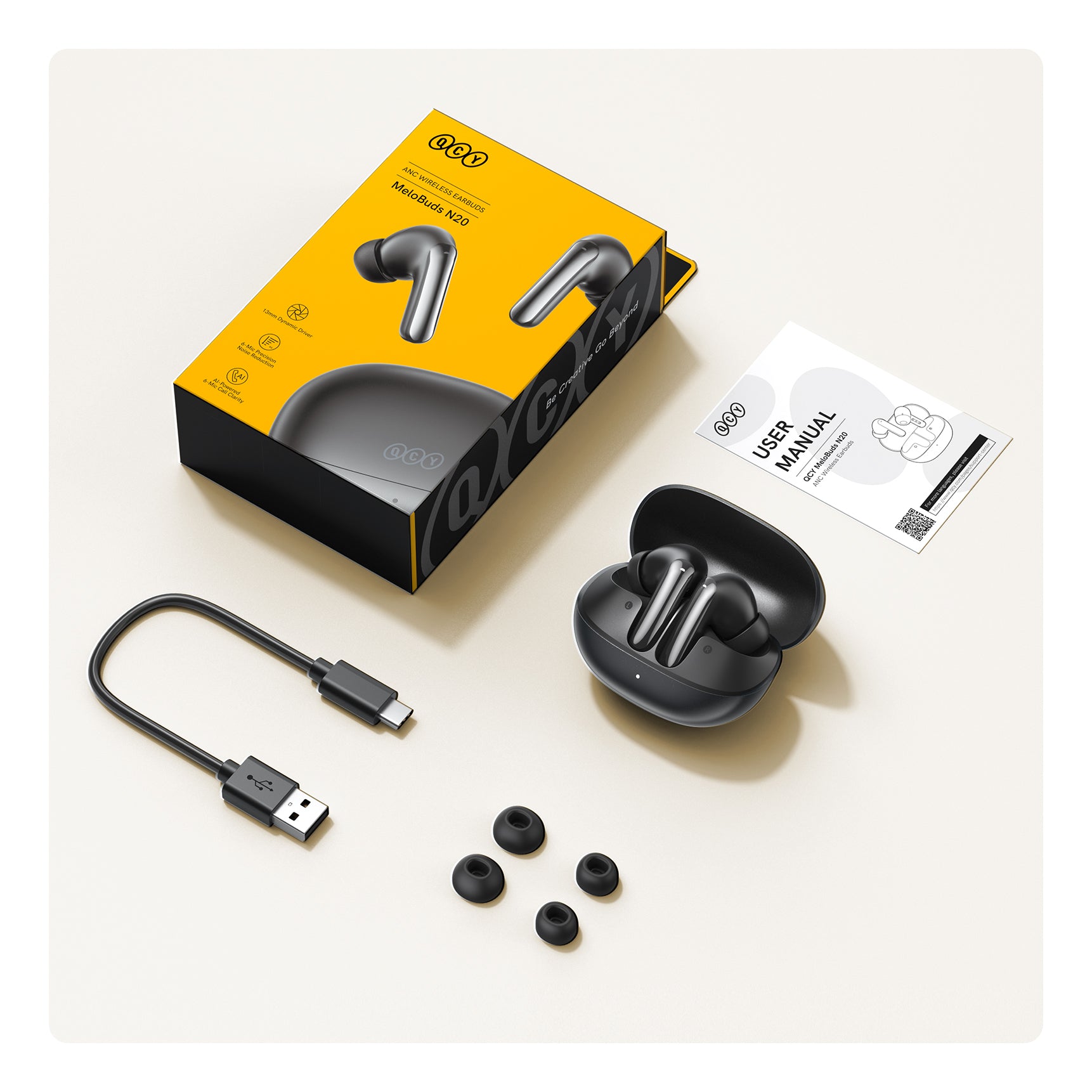 Słuchawki Bluetooth QCY MeloBuds N20 ANC z etui ładującym, kablem USB-C i zapasowymi wkładkami dousznymi.